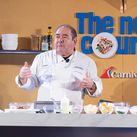Chief Culinary Officer Emeril Lagasse puts on a cooking demo showcasing one of Carnival's culinary creations