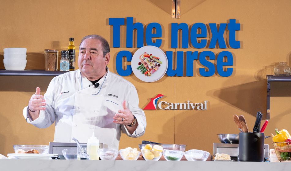 Chief Culinary Officer Emeril Lagasse puts on a cooking demo showcasing one of Carnival's culinary creations