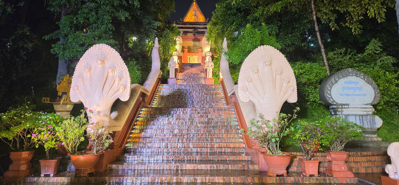 Image: GX kicked off in the rain at Wat Phnom in Cambodia. (Photo Credit: Jen Mallia/TravelPulse Canada)