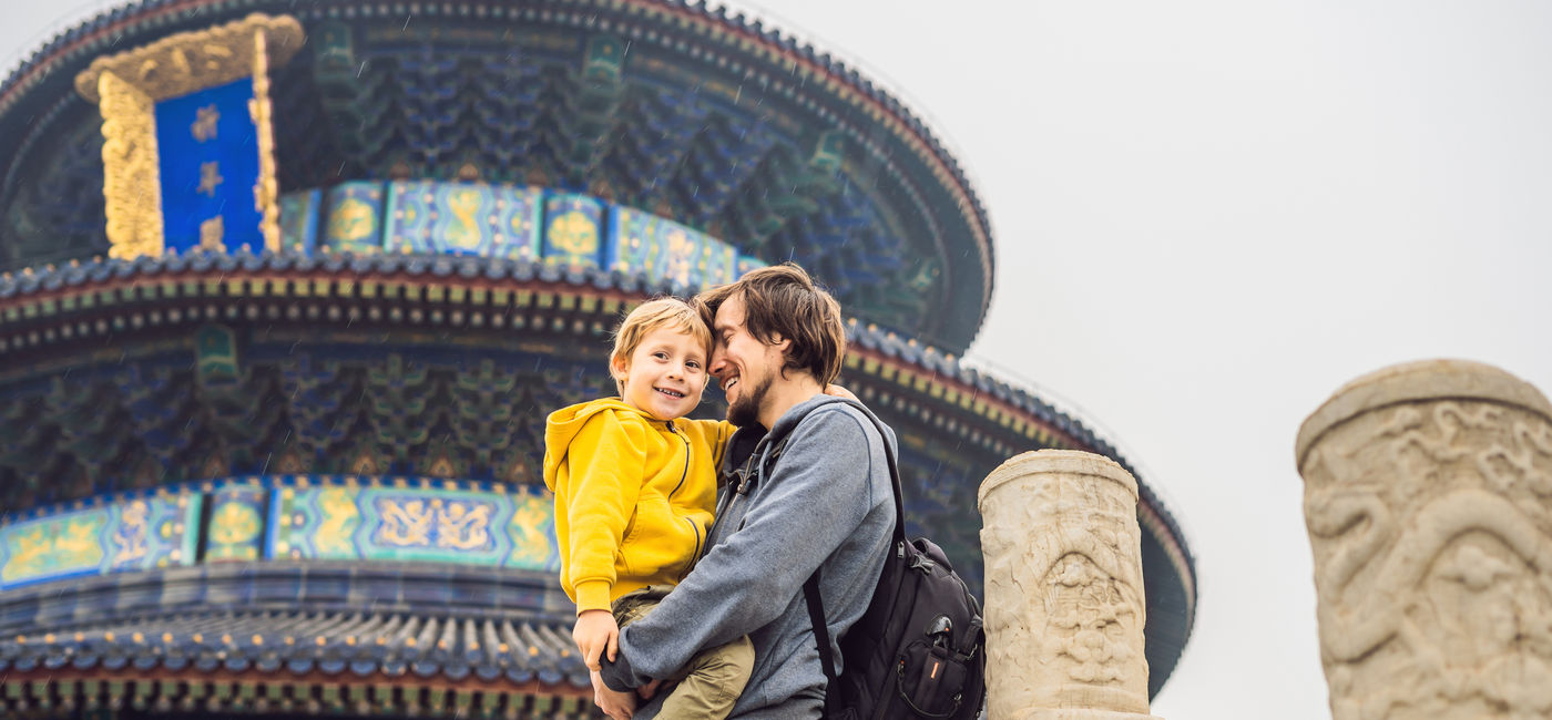Image: A father and son visiting the Temple of Heaven in Beijing. (Photo Credit: galitskaya / Adobe Stock)