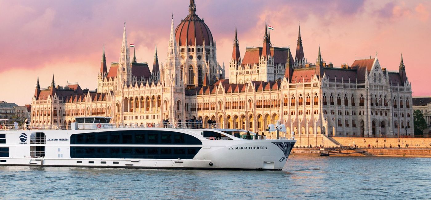 Image: Uniworld Boutique River Cruises' S.S. Maria Theresa sails past the Hungarian Parliament Building in Budapest, Hungary. (Photo Credit: Uniworld Boutique River Cruises)