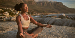 Woman practicing yoga on a Goway Ultimate Wellness vacation.