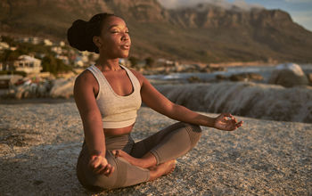 Woman practicing yoga on a Goway Ultimate Wellness vacation.