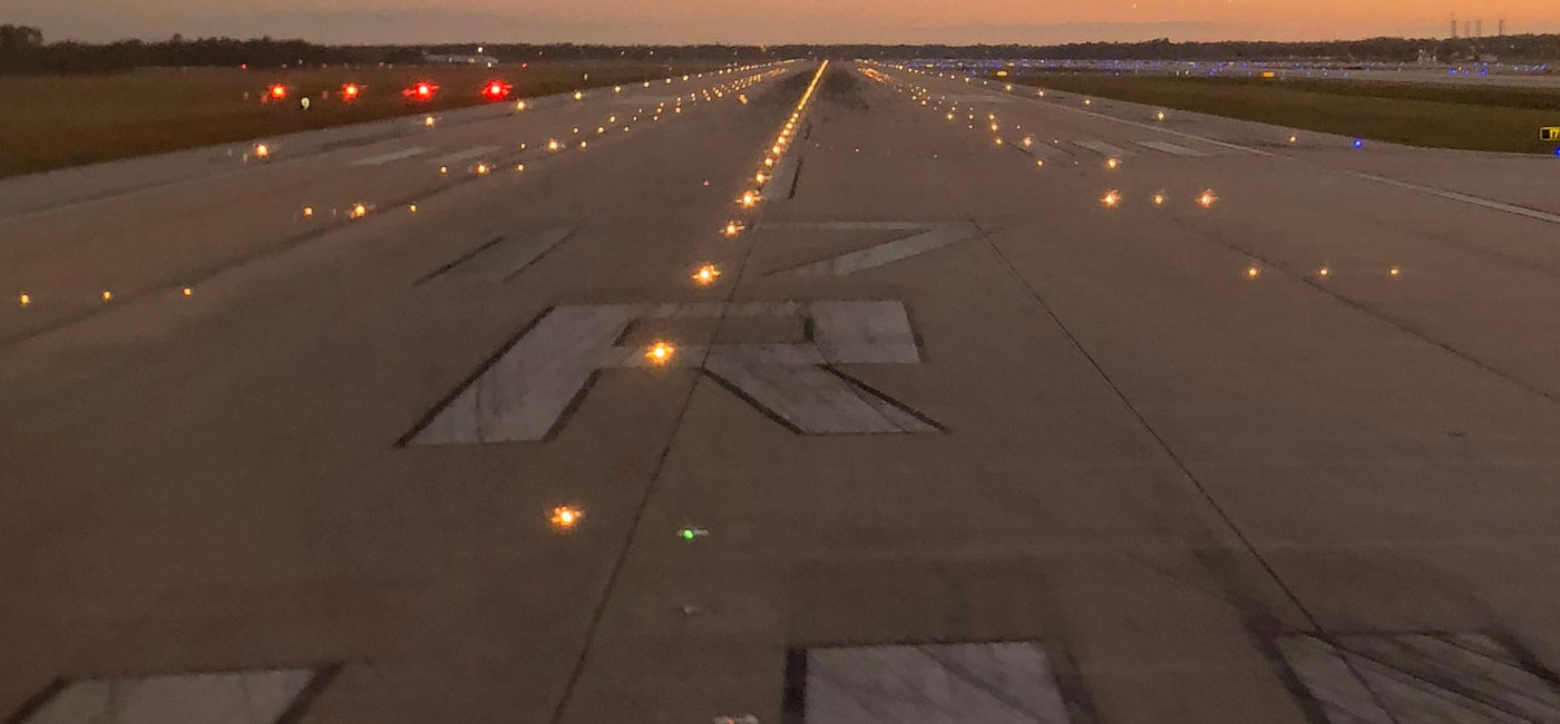 Image: The runway at Orlando International Airport as twilight descents. (Photo Credit: Photo by Paul J. Heney.)