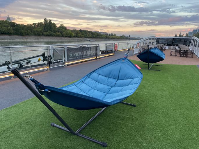 Travelers can relax and unwind in several large hammocks on the sun deck