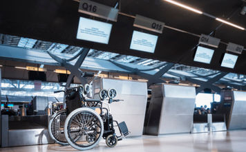 Wheelchair at airline check-in counter.