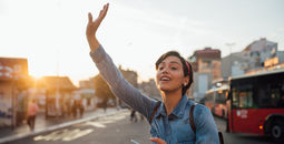 Woman waiving to Uber driver.