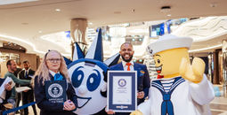 Guinness World Records adjudicator Beverley Williams and MSC World America cruise director Eversen Bevelle celebrate the new world record