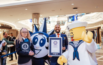 Guinness World Records adjudicator Beverley Williams and MSC World America cruise director Eversen Bevelle celebrate the new world record