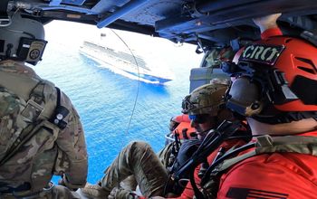 Members of the 920th Rescue Wing approach Carnival Venezia over Atlantic Waters.