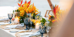 A wedding reception setting and centerpiece at Sandals Resorts in Jamaica.