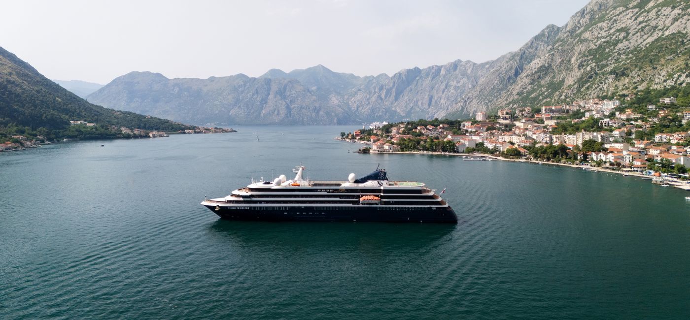 Image: Aerial view of the World Traveller in Montenegro. (Photo Credit: Atlas Ocean Voyages)