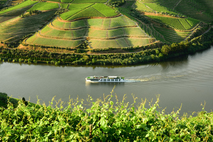 The Scenic Azure sails past vineyards on the Douro River in Portugal The Scenic Azure sails past vineyards on the Douro River in Portugal
