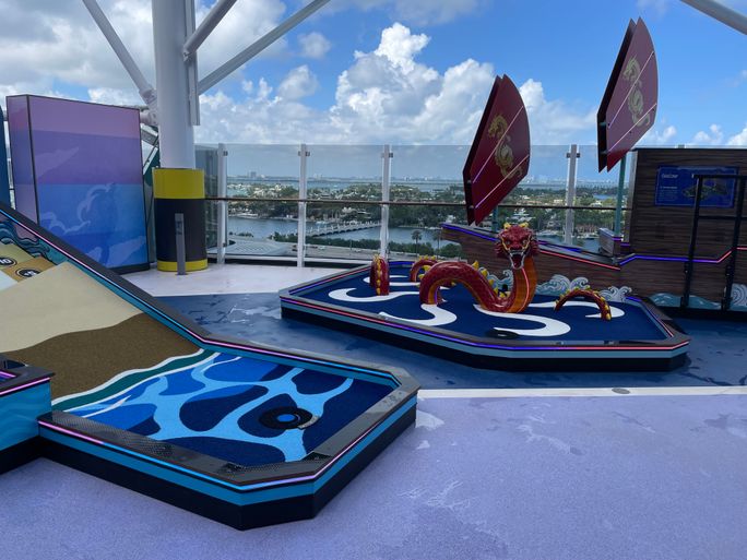 Families can play carnival-style games, including mini golf, on the Luna Midway