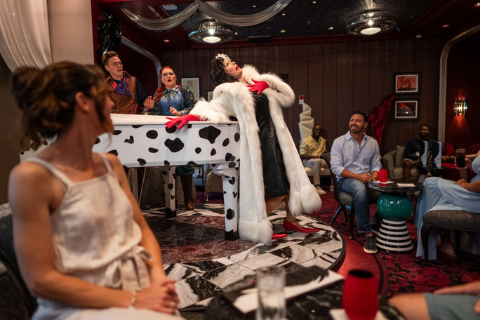 Cruella de Vil occasionally pops into her namesake lounge to stir up a bit of drama. Cruella de Vil occasionally pops into her namesake lounge to stir up a bit of drama.