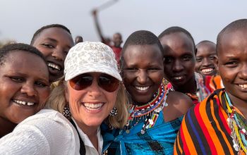Travellers visit a Maasai village in Kenya during a small-group tour with Collette