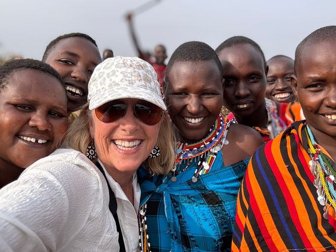 Travellers visit a Maasai village in Kenya during a small-group tour with Collette Travellers visit a Maasai village in Kenya during a small-group tour with Collette