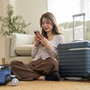 Woman booking travel from her smartphone