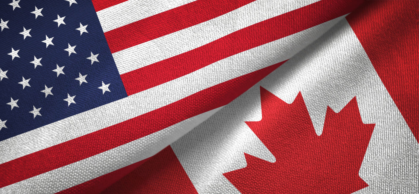 Image: The flags of the US and Canada (Photo Credit: Oleksii/Adobe Stock)