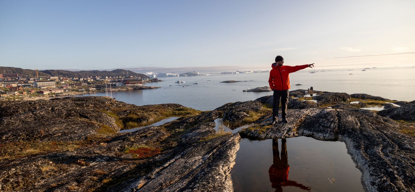Image: A traveler in Ilulissat, Greenland on an Intrepid Travel trip. (Photo Credit: Intrepid Travel)