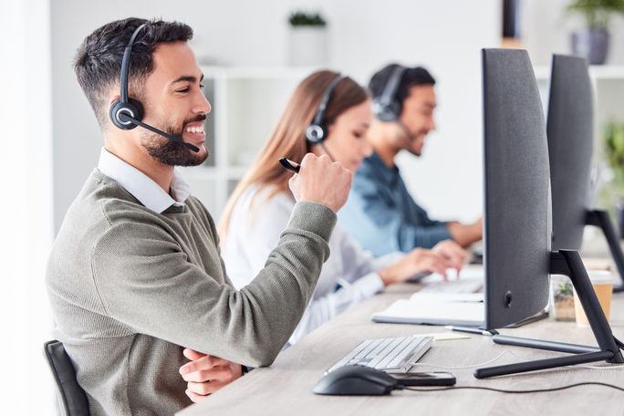 Customer support team members working in a call center.