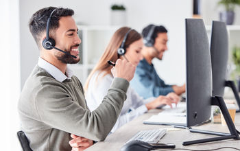 Customer support team members working in a call center.
