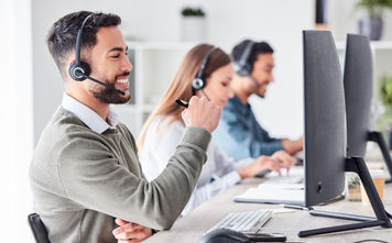 Customer support team members working in a call center.