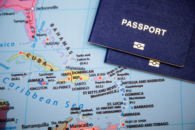 Passports on a map of the Caribbean region.