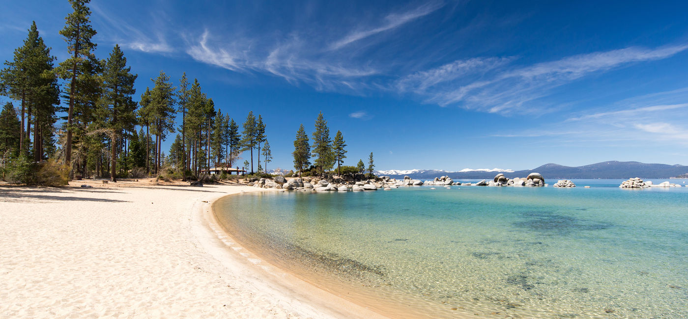 Image: A beach along Lake Tahoe. (Photo Credit: Ekaterina Elagina / Adobe Stock)