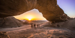 Jordan Wadi Rum Desert rock arch underneath sunset