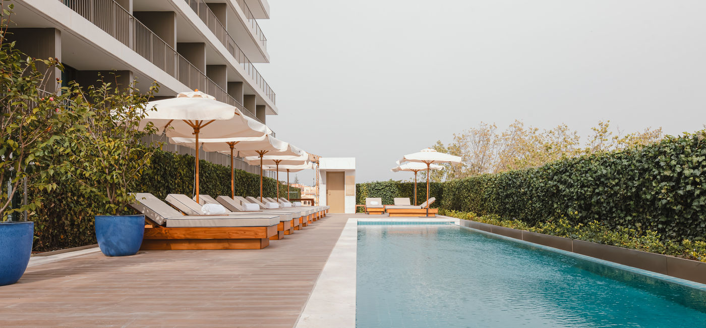 Image: The outside pool at the Legacy Hotel Cascais, Curio Collection by Hilton. (Photo Credit: © 2024 Hilton)