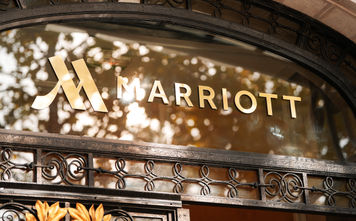 Marriott logo on a hotel facade in Paris, France.