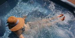 Woman soaking in a cruise ship hot tub