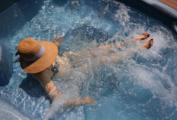 Woman soaking in a cruise ship hot tub