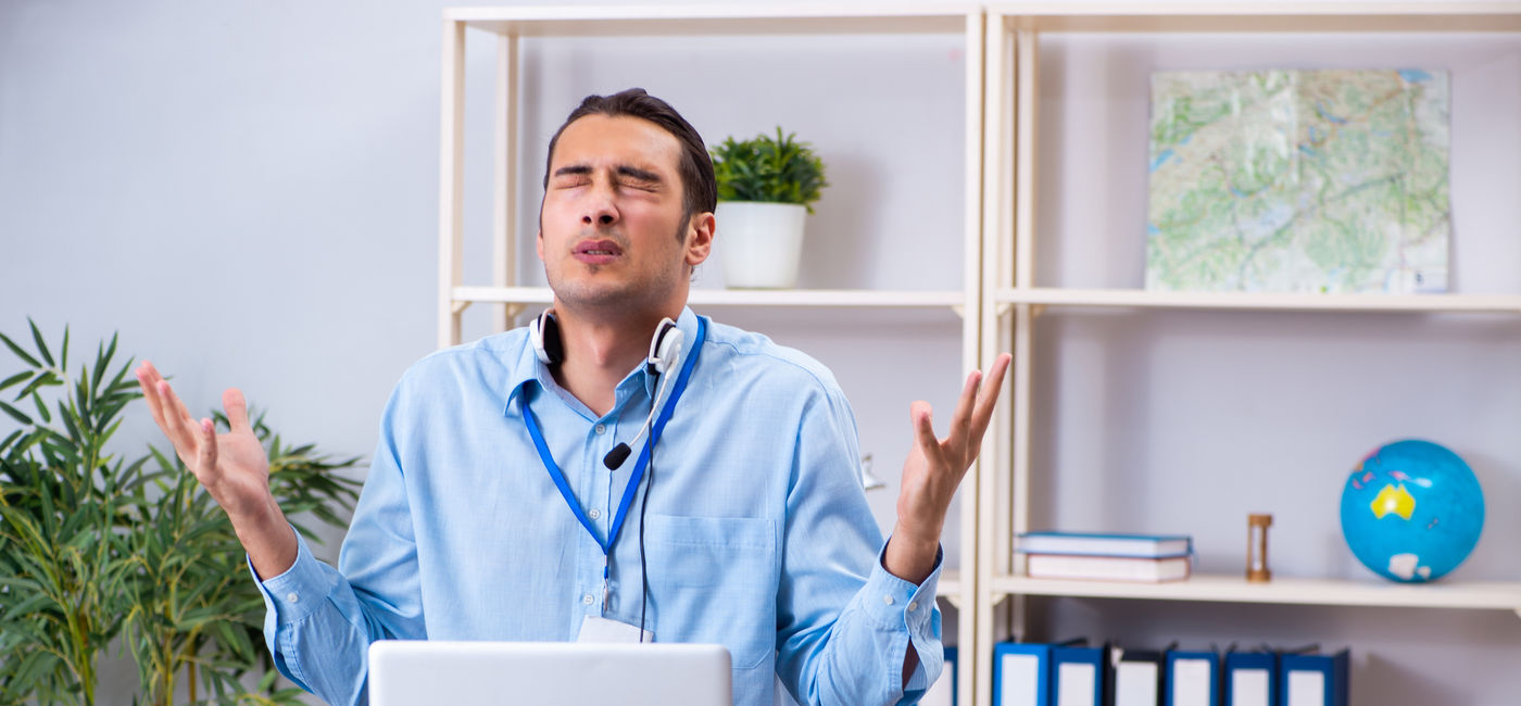 Image: Frustrated travel advisor. (Photo Credit: Adobe Stock/Elnur)