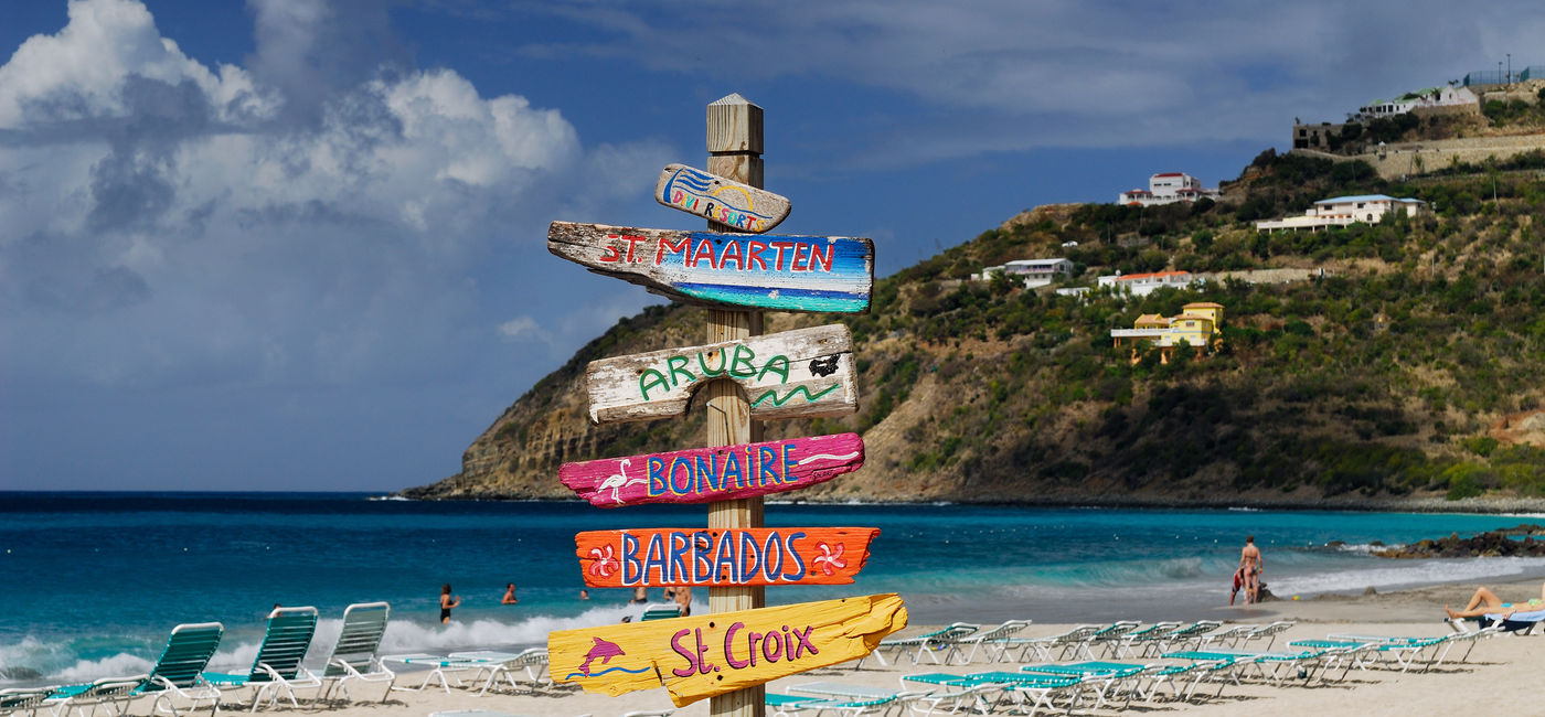 Image: Signpost pointing the way to various Caribbean Islands. (Photo Credit: Adobe Stock/Reimar)