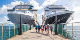 Two cruise ships on either side of dock, cruise ships, stock image of cruise ships