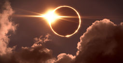 Total solar eclipse seen amid the clouds.
