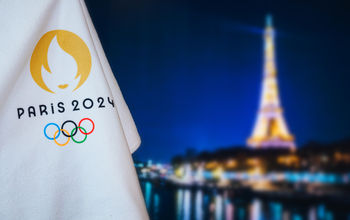 Flag bearing the official logo of the 2024 Paris Summer Olympic Games.