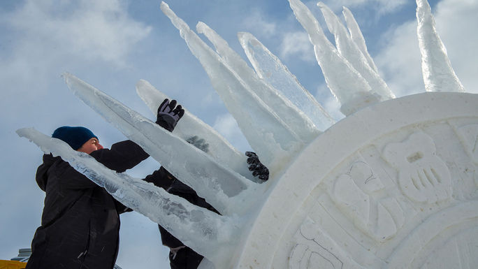 Competitors in the International Snow Sculpture Championships at work