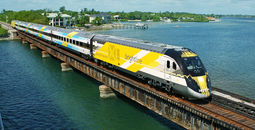 Bright Blue, one of Brightline's eco-friendly trains, on a bridge in south Florida.