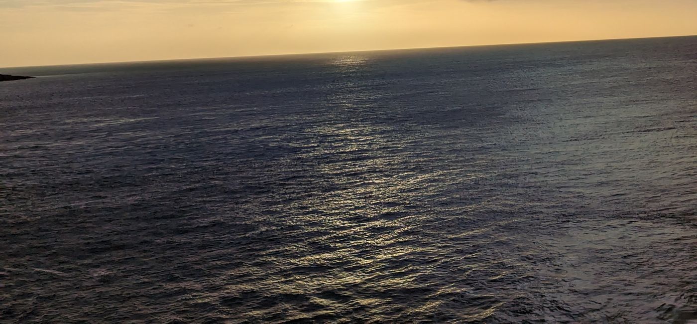 Image: Sunset over the ocean while on cruise (Photo Credit: Eric Bowman)
