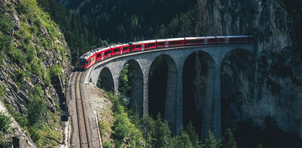 Rail Europe train traveling through the mountains