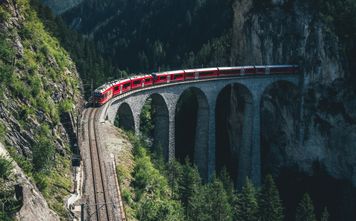 Rail Europe train traveling through the mountains