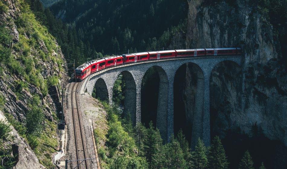 Rail Europe train traveling through the mountains