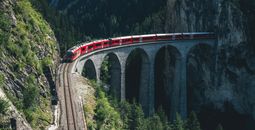 Rail Europe train traveling through the mountains