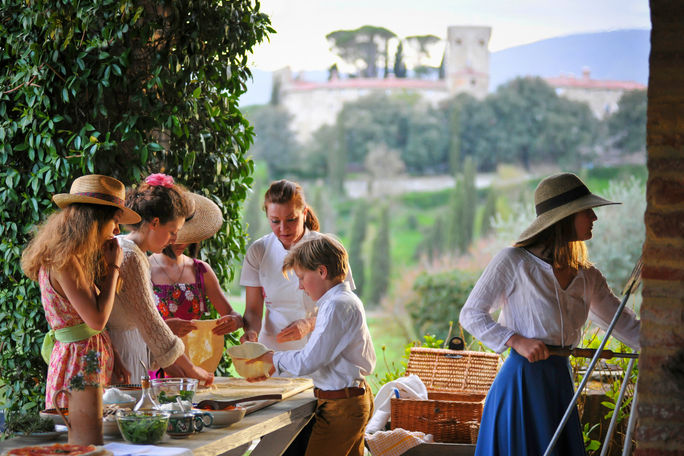 A family enjoying a cooking destination at a European villa.