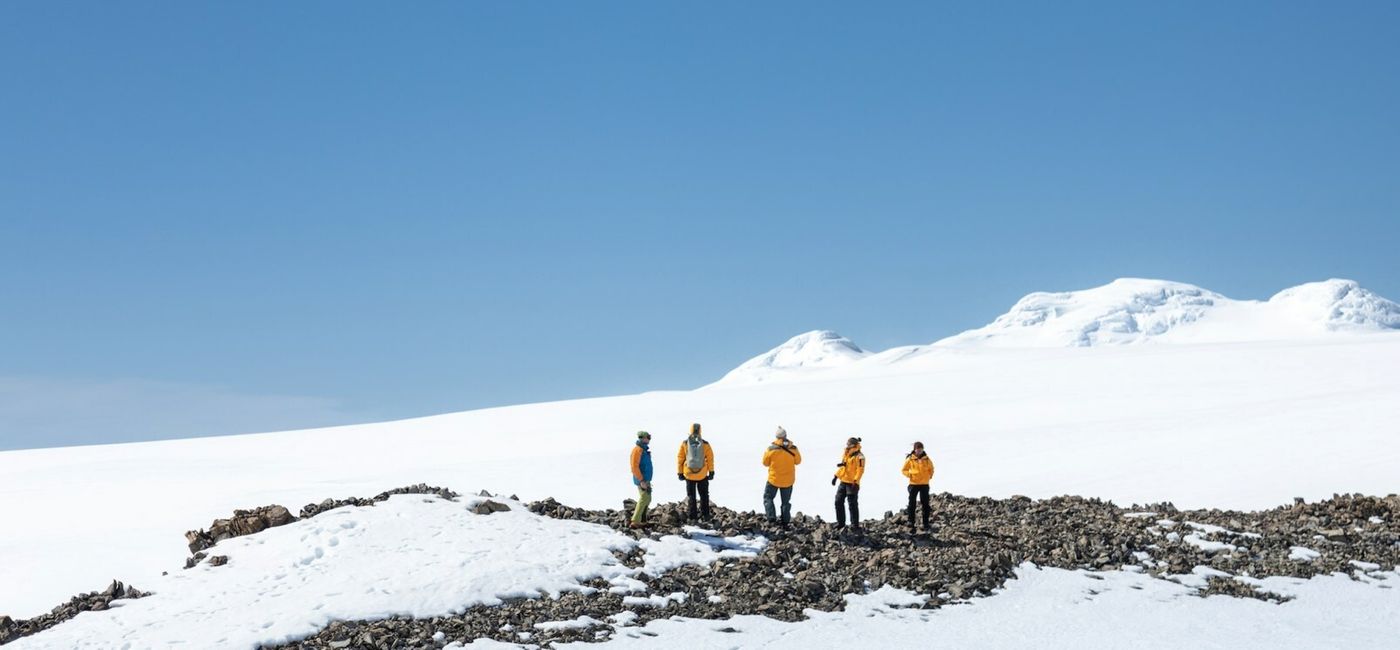 Image: Travelers enjoying a Quark Expeditions helicopter tour. (Photo Credit: Michelle Sole) Quark Expeditions Antarctica Season
