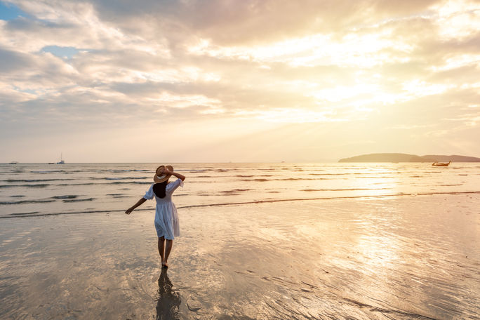 Summer traveler enjoying the beach