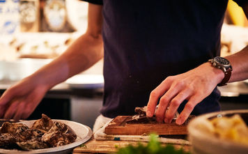 Restaurant worker preparing oysters in Vancouver